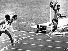 Hasely Crawford, far right, of Trinidad and Tobago, crosses the finish line to win the gold medal on July 24