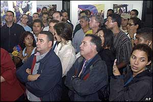 Opposition supporters watch results on television