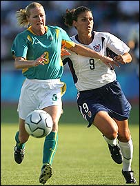 Sacha Wainwright (left) attempts to fend off Mia Hamm 