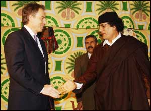 Tony Blair and Muammar Gaddafi shake hands. The pair met in a Bedouin tent outside Tripoli