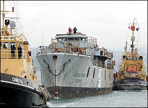 Frigate is tugged out of dock