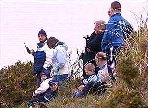 Families wait for the sinking