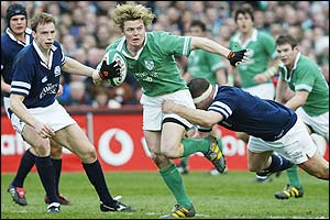 Brian O'Driscoll is tackled by Scotland's Bruce Douglas