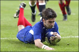 France's Dimitri Yachvili scores a try and kicks 11 points during the first half
