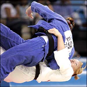 Rachel Wilding (white) throws her opponent