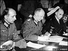 General Jodl, centre, flanked by an aide on the left and Gen-Admiral Hans George von Friedeburg (R) 