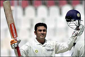 Virender Sehwag celebrates after scoring his triple century 