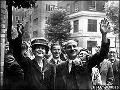 British Prime Minister Clement Attlee (1883 - 1967) and his wife waving to crowds on their arrival at Transport House, London. 