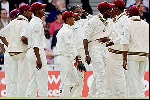 West Indies bowler Charles Lawson celebrates the wicket of Geraint Jones