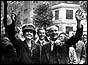 British Prime Minister Clement Attlee (1883 - 1967) and his wife waving to crowds on their arrival at Transport House, London. 