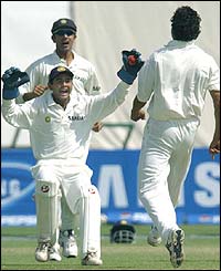 India's wicketkeeper Parthiv Patel congratulates Anil Kumble 