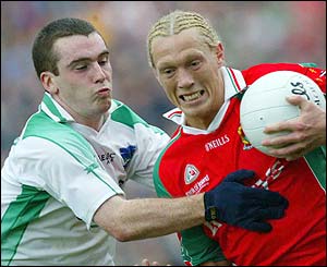 Mayo's Kieran McDonald comes under pressure from Niall Bogue