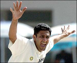 Indian bowler Anil Kumble celebrates the wicket of Imran Farhat