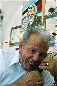 Ammar Hassan, speaks with a spokesman for Palestinian leader Yasser Arafat