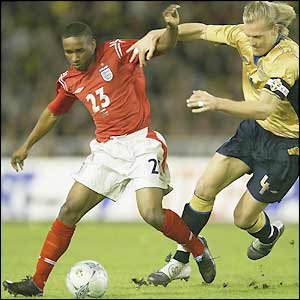 Jermain Defoe tries to unsettle the Sweden defence