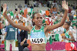 Defar wins in a time of 14 minutes, 45.63 seconds