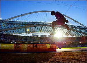 Cameroon's Francoise Mbango Etone competes in the women's triple jump final at the Olympic Stadium