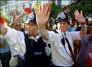 Policeman join the revellers in 2001