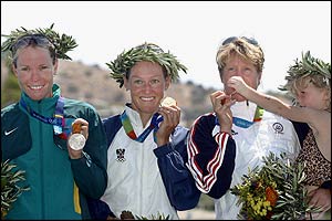 Loretta Harrop, Kate Allen and bronze medal-winner Susan Williams of the USA with her young daughter