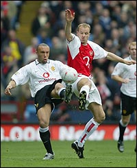 Mikael Silvestre and Dennis Bergkamp