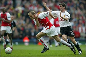 Dennis Bergkamp and Roy Keane