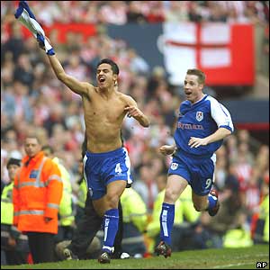 Tim Cahill runs the length of the pitch in celebration