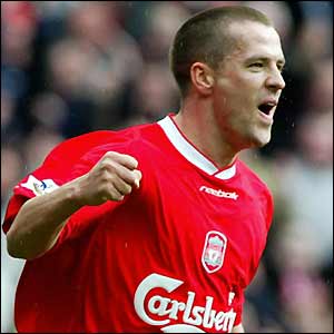 Michael Owen celebrates scoring his second goal against Blackburn