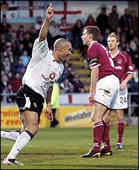Mikael Silvestre celebrates scoring against Northampton