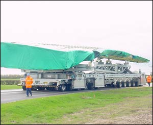 The wing makes its way to the barge