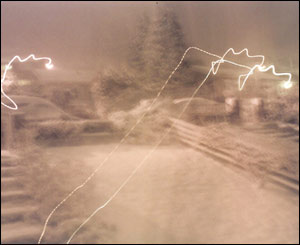 Jan Summers, from Abercaniad, sent in this picture of recent snow through her living room window with the flash reflecting off streetlights and other windows. 