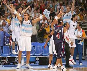 Argentina celebrate defeating the USA as USA's Allen Iverson walks off dejected 