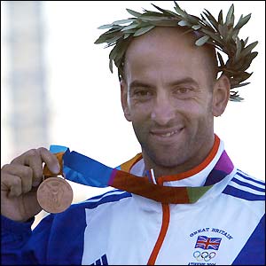 Great Britain's Ian Wynne shows off his bronze medal