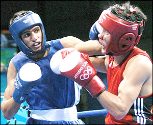 Serik Yeleuov feels the full force of a telling left-hand blow from Khan in the semi-final match