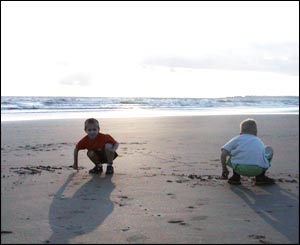 Steve Salter's children writing their names in the sand at Ogmore by Sea beach