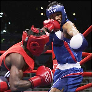 Guillermo Rigondeaux lands a shot on Thailand's Worapoj Petchkoom on his way to winning the gold