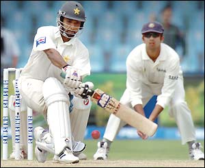 Asim Kamal sweeps during his innings of 73