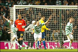Henrik Larsson wheels away in delight after heading home Didier Agathe's cross to equalise for Celtic