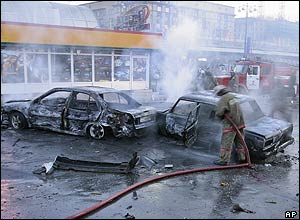 Smoking wreckage of cars 