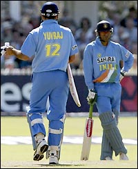 Yuvraj Singh removes his gloves and begins the long walk back to the pavilion with India on 89-5