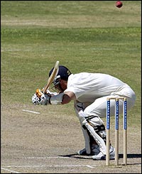 Simon Jones ducks a bouncer during the fourth day of the fourth Test at the Recreation ground