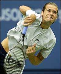 Germany's Tommy Haas serves to Brazil's Ricardo Mello