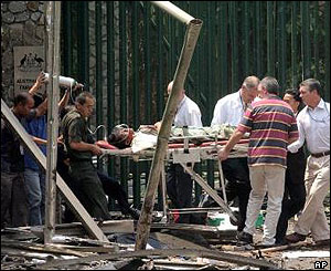 Casualty is carried out of the embassy on a stretcher after the blast