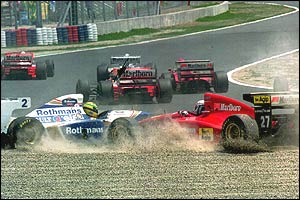 Ayrton Senna's Williams-Renault is hit by Nicola Larini's Ferrari at the first corner of the 1994 Pacific Grand Prix after being knocked off the track by Mika Hakkinen's McLaren-Peugeot
