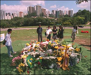 Fans and mourners at Ayrton Senna's grave in Morumbi cemetery in Salo Paulo
