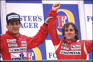 Ayrton Senna holds Alain Prost's arm aloft after the Frenchman beat him in the 1988 Australian Grand Prix