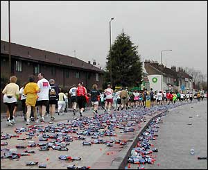 JB Davison sees the route strewn with empty water bottles at the five-mile mark as the stragglers pass through.