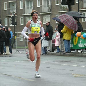 Romania's Tomescu-Dita overtakes Margaret Okayo early on to take the lead