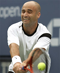 Andre Agassi hits a forehand to number one seed Roger Federer during their quarter-final match