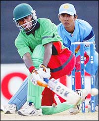 Maurice Ouma is denied a debut fifty as he gloves an Agarkar delivery to the keeper