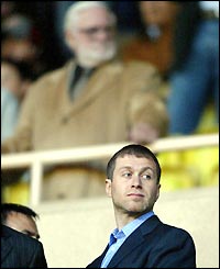 Ken Bates lurks in the background as Roman Abramovich watches from the stands in Monaco